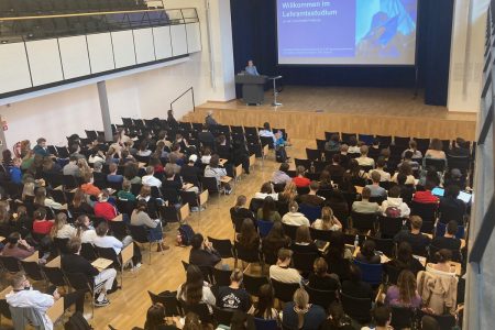 A full lecture hall during a welcome event for new students